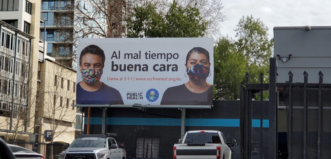 A billboard on Santa Clara Street in downtown San Jose shows a Spanish public health announcement about the use of face masks. Photo by Eugene Luu.