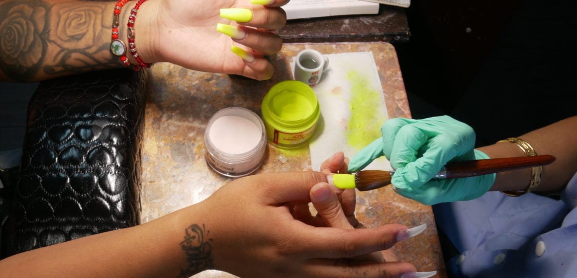 Sara Phung works on a client's nails at Orchid Salon in Santa Clara. Photo by Katie Lauer.