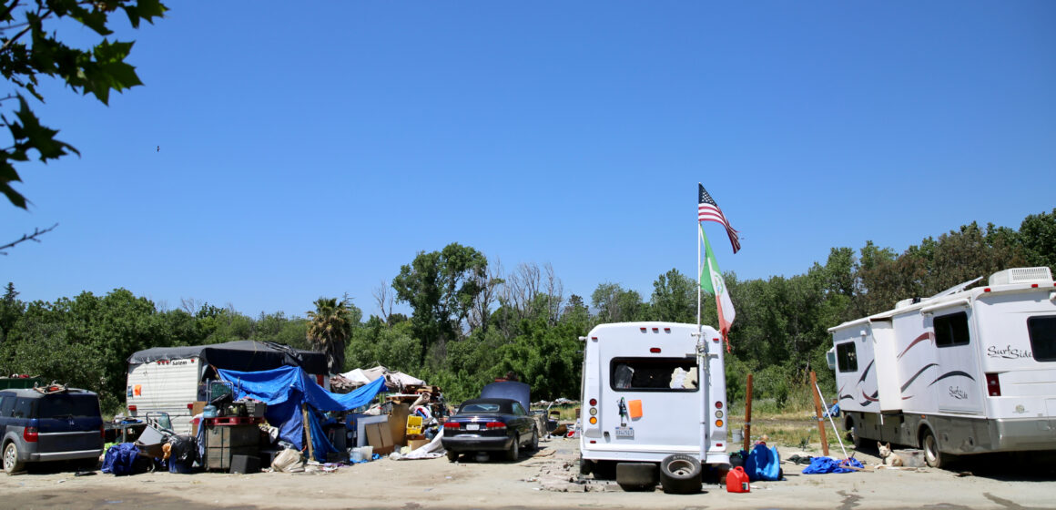 A homeless encampment comprised of cars and RVs