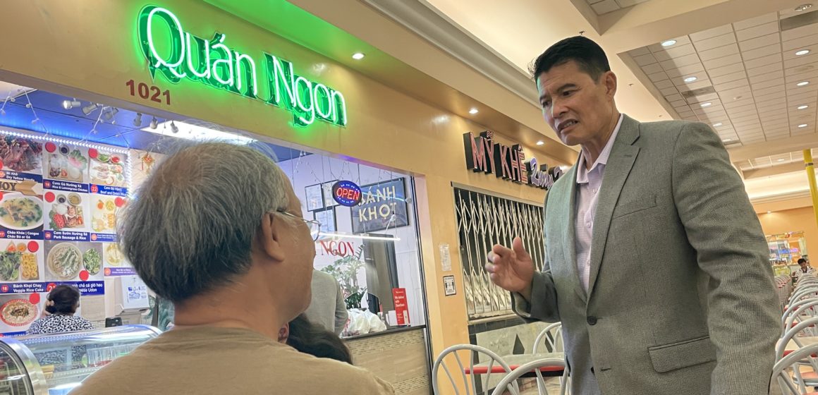 Two men stand inside a shopping center in San Jose