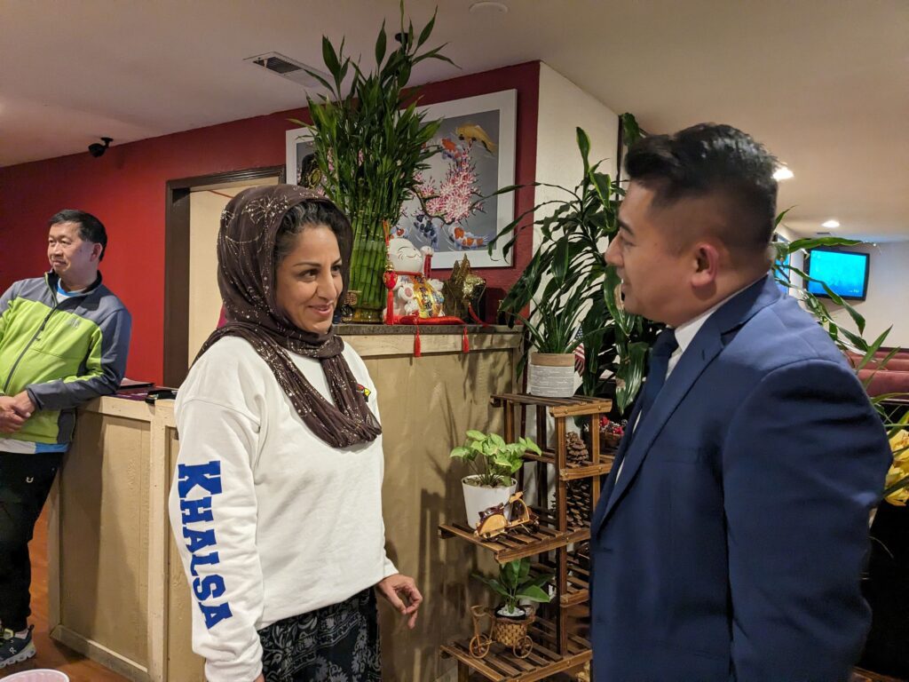 San Jose City Council District 8 candidate Tam Truong speaks to a supporter at his election night party.