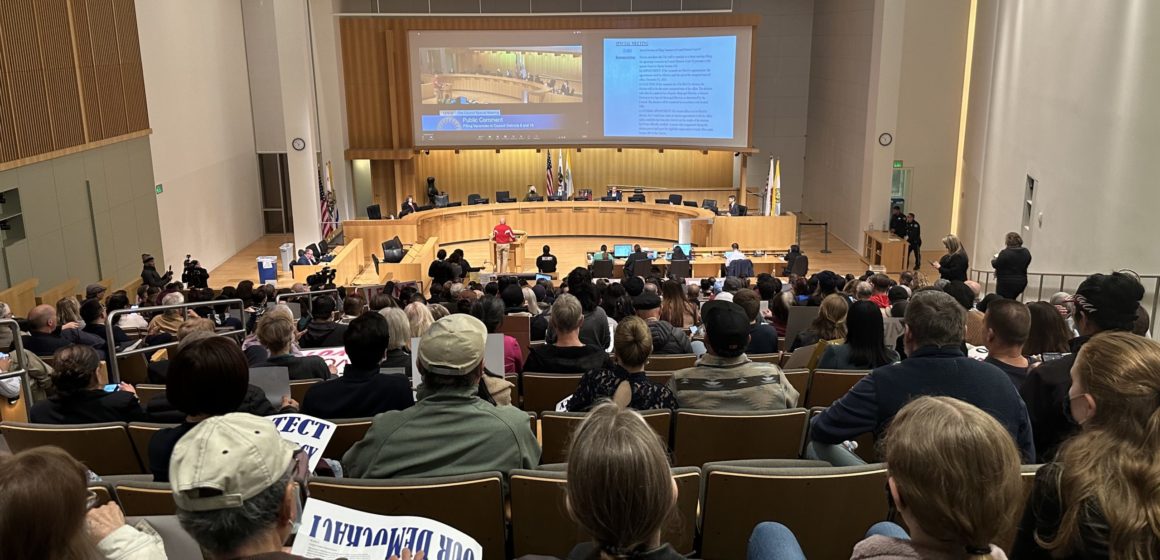 A crowd fills the seats at a San Jose City Council meeting