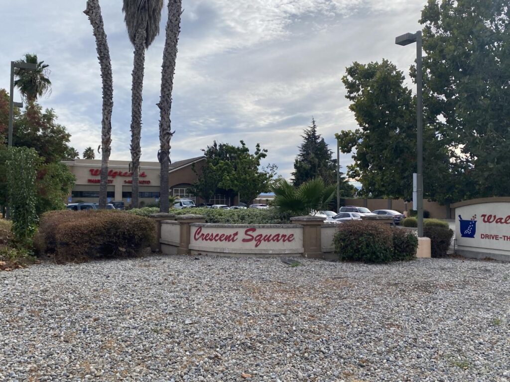 Crescent Square commercial space sign with local Walgreens in background