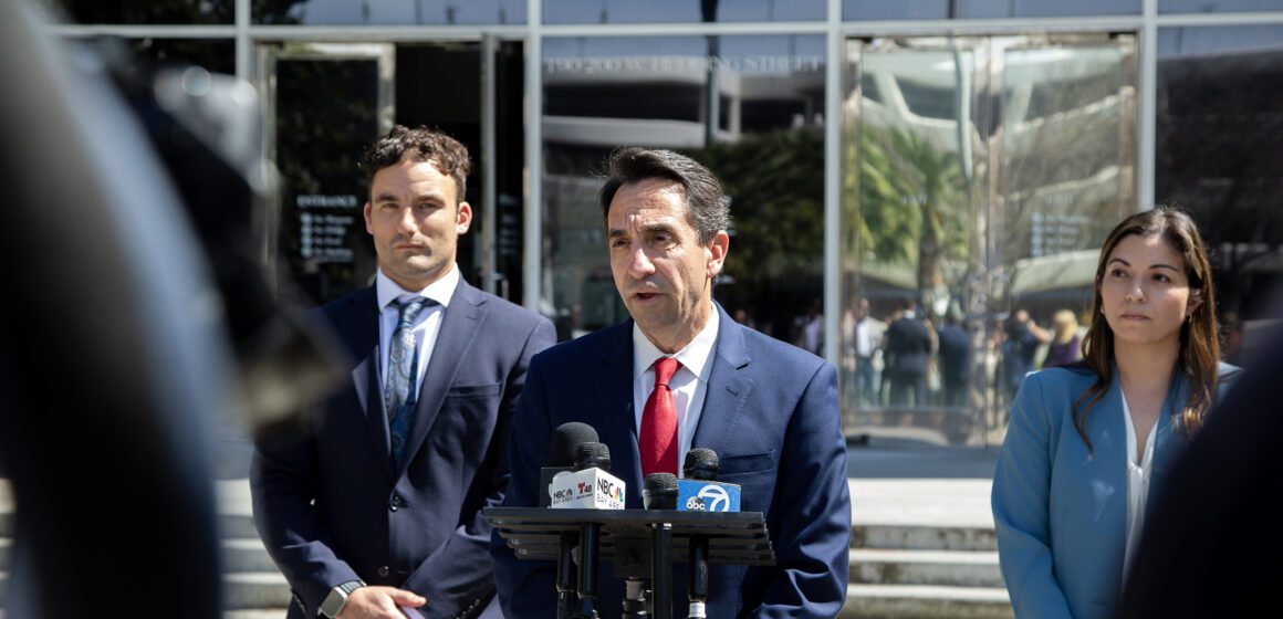 Santa Clara County District Attorney Jeff Rosen speaks outside at a podium