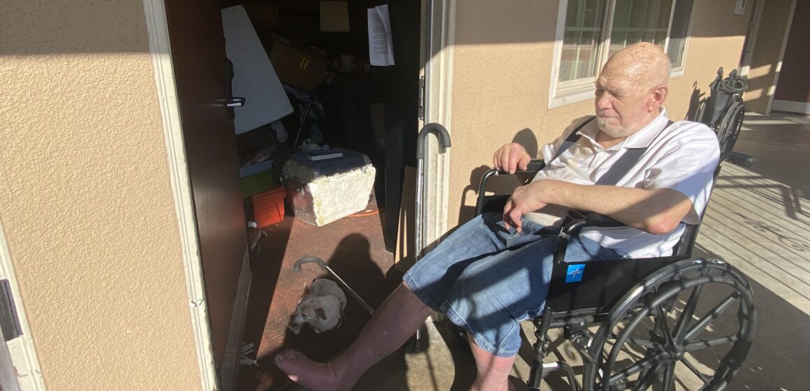 Man in wheelchair in motel