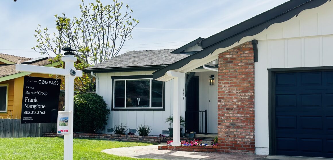 A house in San Jose with a for sale sign on the lawn.