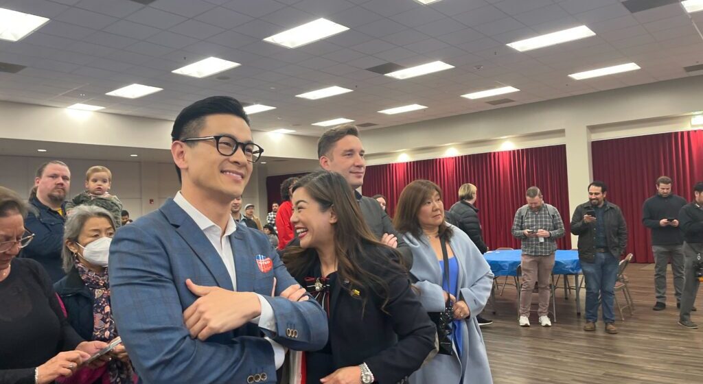 A crowd of people at an election night watch party